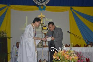Fr. Edwin handed to Fr. Robert the Bible as the source of inspiration and spiritual nourishment